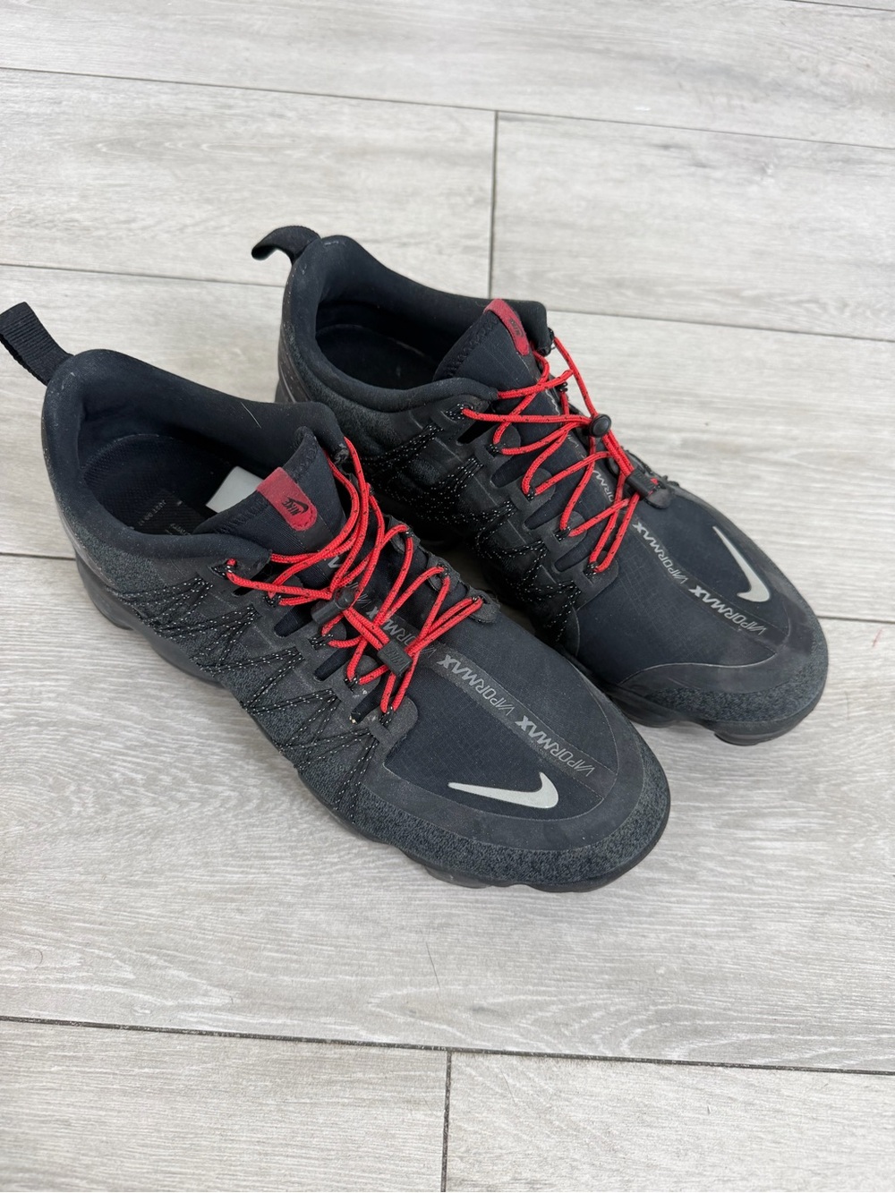 Nike Black Athletic Shoes with Red Laces and Reflective Swoosh